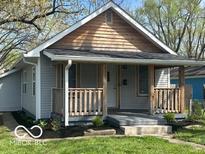 Charming single-Gathering home with a covered front porch and manicured lawn at 4325 Crittenden Ave, Indianapolis, IN 46205