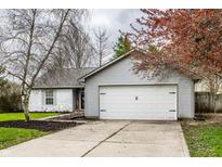 Charming single-story home with a well-maintained front yard and attached two-car garage at 106 W Delaware St, Fortville, IN 46040