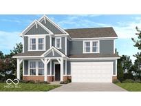 Charming two-story home featuring a two-car garage, gray siding, and a welcoming covered front entry at 1087 Stubble Run, Danville, IN 46122