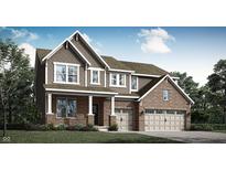 Charming two-story home with a brick and siding exterior, attached two-car garage, and a well-manicured lawn at 15425 Manderley St, Fishers, IN 46040