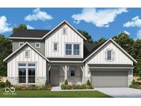 Charming two-story home boasts a modern farmhouse design with stone accents and a well-manicured lawn at 19522 Wood Farm Pl, Westfield, IN 46074