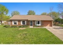 Charming brick ranch with a well-manicured lawn and attached one car garage at 250 3 Notch Ln, Bargersville, IN 46106