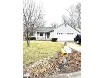 Charming one-story home featuring an attached two-car garage and well-maintained front lawn at 952 Delray Dr, Indianapolis, IN 46241