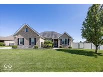 Charming home with beautiful lawn, attractive landscaping, and a well-maintained exterior at 2803 Wild Orchid Way, Columbus, IN 47201