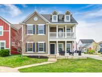 Charming two-story home featuring a covered front porch, black shutters, and well-maintained lawn at 5954 Crowley Pkwy, Whitestown, IN 46075