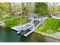 Stunning waterfront home with a private dock and boat lift, perfect for lake living at 7456 Heather Ct, Nineveh, IN 46164