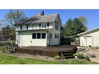 Inviting backyard featuring a spacious wooden deck perfect for outdoor entertaining and relaxation at 8200 E Desoto St, Muncie, IN 47303
