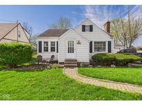 Charming single-Gathering home featuring tidy landscaping and a walkway leading to the front door at 1327 Lindberg Rd, Anderson, IN 46012