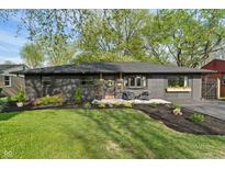 Charming home with a well-manicured lawn, tasteful landscaping, and updated paint at 165 N 9Th St, Zionsville, IN 46077