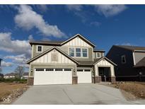 Two-story home featuring a two car garage, stone accents, neutral siding and a concrete driveway at 3867 Andean Ct, Bargersville, IN 46106