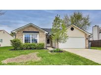 Charming single-story home featuring brick and vinyl siding, attached garage, and well-maintained lawn at 6218 Churchman Way, Indianapolis, IN 46237
