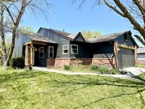 Quaint single-Gathering home featuring neutral siding, brick accents, and a well-manicured lawn at 653 Southridge Ct, Westfield, IN 46074