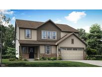 Charming two-story home with a brick foundation and an attached garage at 7236 Estes Dr, Indianapolis, IN 46239