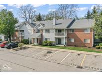 Attractive multi-Gathering home with ample parking and a combination of siding and brick exterior at 8216 Glenwillow Ln # 104, Indianapolis, IN 46278