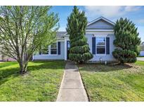 Charming single-story home with a well-manicured lawn and attractive landscaping at 11603 Presidio Dr, Indianapolis, IN 46235