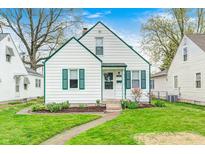 Charming home featuring a well-maintained front yard and classic architectural details at 1231 Nester St, Speedway, IN 46224
