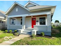 Charming home featuring a well-maintained front yard and inviting entrance at 1510 W 22Nd St, Indianapolis, IN 46202