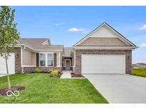 Charming single-story brick home with a manicured lawn, attached two-car garage, and inviting entryway at 2249 Aviary Ln, Danville, IN 46122