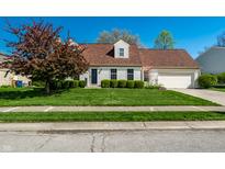 Charming single-Gathering home featuring a well-manicured lawn, complementary landscaping, and a two-car garage at 8142 Bittern Ln, Indianapolis, IN 46256