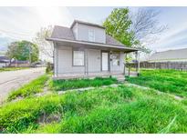 Quaint two-story home featuring a cozy front porch and fresh exterior paint at 274 Leeds Ave, Indianapolis, IN 46201