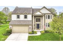 Beautiful two-story home featuring brick and siding exterior, an attached two-car garage, and manicured landscaping at 6164 Parrington Dr, Indianapolis, IN 46236