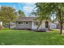 Charming single-story home with a well-maintained lawn and lovely curb appeal at 2539 E 68Th St, Indianapolis, IN 46220