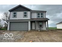 Charming two-story home with a gray garage door and gray accents under a cloudy sky at 3312 W Longbranch Dr, Monrovia, IN 46157