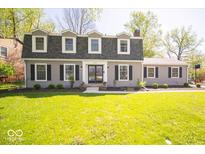 Charming two-story home featuring a well-manicured lawn and inviting front entrance at 5829 Lasalle St, Indianapolis, IN 46220