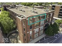 Exterior building featuring large windows and brick facade; an ideal location for living and working at 624 E Walnut St # 46, Indianapolis, IN 46204