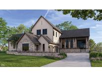 Charming stone and siding two-story home featuring a manicured lawn and attached two car garage at 1509 Chatham Rdg Ct, Westfield, IN 46074