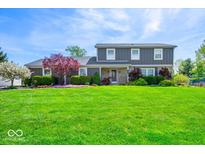 Charming two-story home with stone accents and a lush, green lawn at 223 Haldale Dr, Carmel, IN 46032
