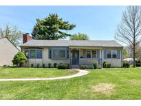 Charming single-story home features a well-manicured lawn and inviting walkway at 251 S 12Th Ave, Beech Grove, IN 46107
