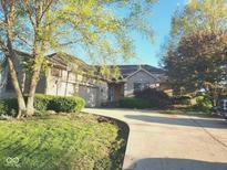 Charming brick home featuring a well-manicured front yard and long, private driveway at 1605 Fox Dr, Martinsville, IN 46151