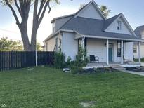 Two-story home featuring charming curb appeal with a well-kept lawn and classic design at 40 N Park Ave, Martinsville, IN 46151