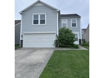 Charming two-story home with light gray siding, a white garage door, and manicured lawn at 4070 Presidio Cir, Indianapolis, IN 46235