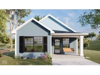 Charming single-Gathering home with horizontal siding, black shutters, front porch, and an inviting swing at 953 Udell St, Indianapolis, IN 46208