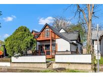 View of a two story home with an attractive wooden porch at 257 N Tacoma Ave, Indianapolis, IN 46201