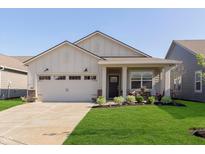 Charming single-story home featuring a two-car garage, inviting front porch, and manicured lawn at 796 Sapp Cir, Westfield, IN 46074
