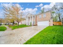 Stately two-story brick home with a grand entrance and a well-kept front yard at 10090 Eagle Eye Way, Indianapolis, IN 46234