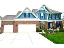 Charming home featuring a three-car garage and beautiful landscaping at 13766 Heatherfield Dr, Fishers, IN 46038