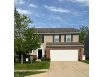 Charming two-story home with a well-maintained lawn and a spacious two-car garage at 15406 Destination Dr, Noblesville, IN 46060