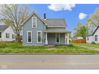 Charming two-story home with a covered front porch and light blue siding at 524 S State St, Greenfield, IN 46140