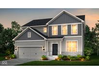 Charming two-story home boasts gray siding, stone accents, and a two-car garage at 6871 Seabiscuit Rd, Whitestown, IN 46075