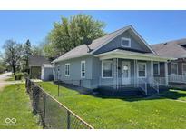 Charming single-Gathering home with a cozy front porch and a well-maintained, fenced yard at 1401 W 34Th St, Indianapolis, IN 46208