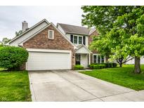 Charming two-story brick home featuring an attached two-car garage and a well-maintained front yard at 4227 Short Ter, Carmel, IN 46033
