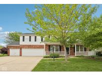 Charming two-story home with brick accents, white siding, covered porch, and a well-manicured front lawn at 5 Statesman Ct, Brownsburg, IN 46112