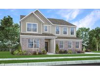 Charming two-story home featuring a combination of brick and siding, surrounded by a well-maintained lawn and garden at 1103 Marston Ln, Avon, IN 46123