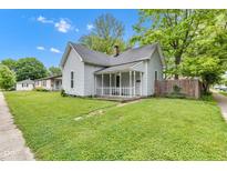 Charming home with a welcoming front porch and a lush green lawn at 1508 Monument St, Noblesville, IN 46060