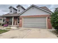 Charming single-Gathering home with a two-car garage and brick accents at 3085 Oakmont Dr, Lapel, IN 46051