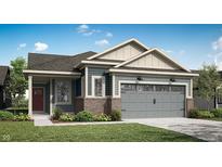 Charming home featuring blue siding, brick accents, and a gray garage door on a sunny day at 5308 W Glenview Dr, McCordsville, IN 46055